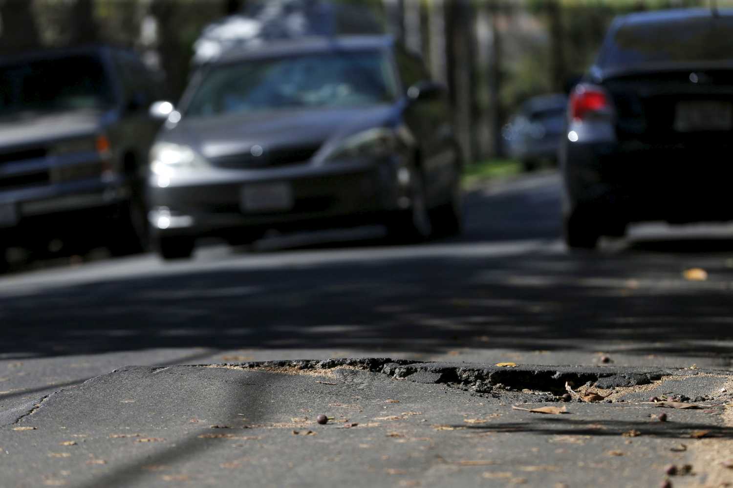 A pothole is pictured on the street of Los Angeles, California