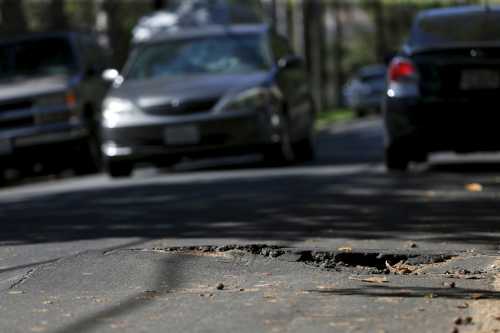A pothole is pictured on the street of Los Angeles, California