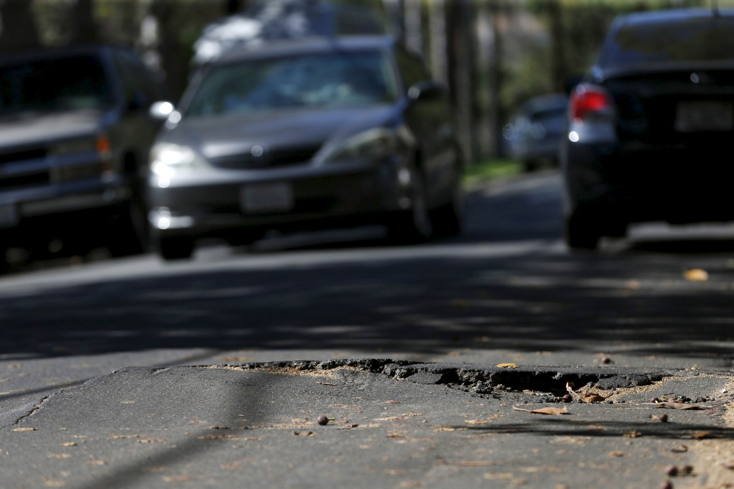 A pothole is pictured on the street of Los Angeles, California