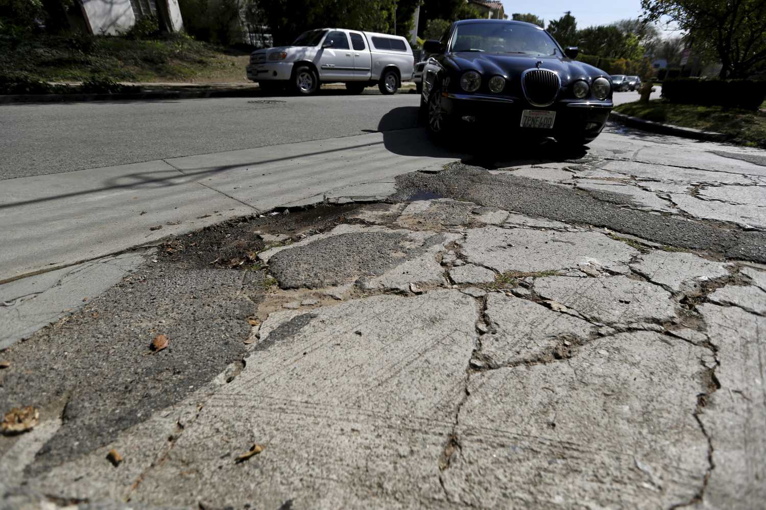 A pothole is pictured on the street of Los Angeles, California
