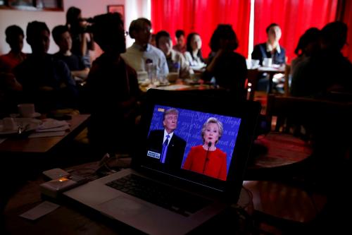 People watch live broadcast of the first U.S. presidential debate