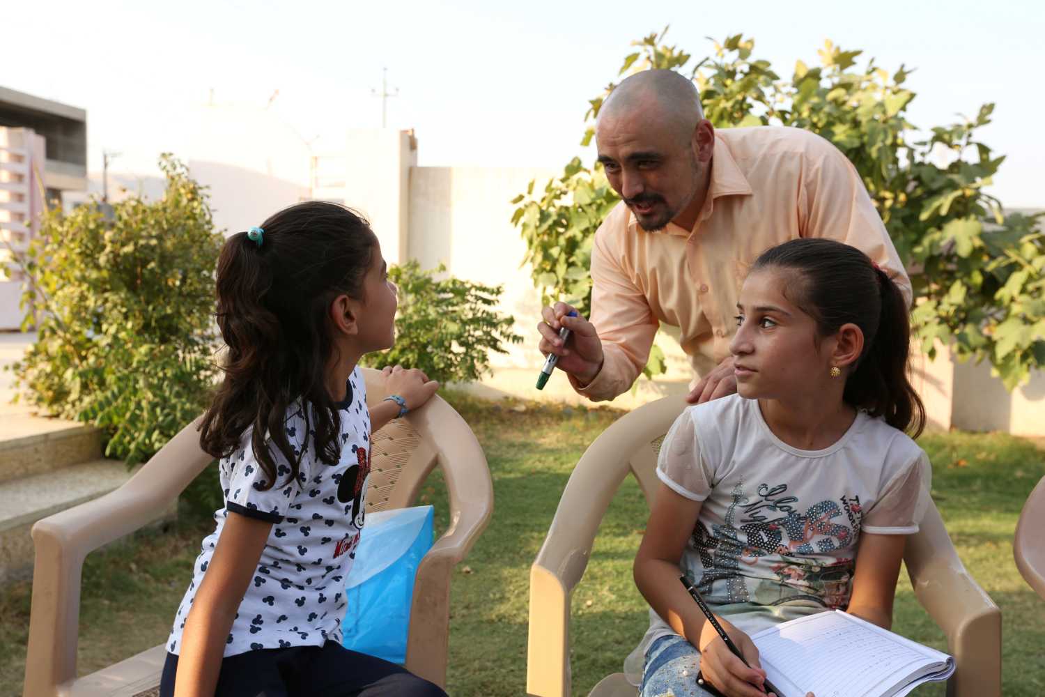 Siraj Davis, a Japanese-American teacher, conducts an English course