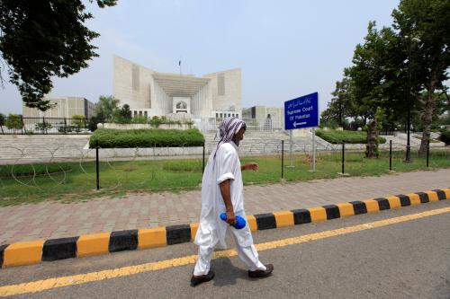 A man walks past the Supreme Court building in Islamabad, Pakistan. REUTERS/Faisal Mahmood