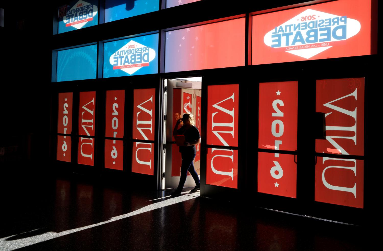 Image of a person entering the media workspace at UNLV prior to the third presidential debate.