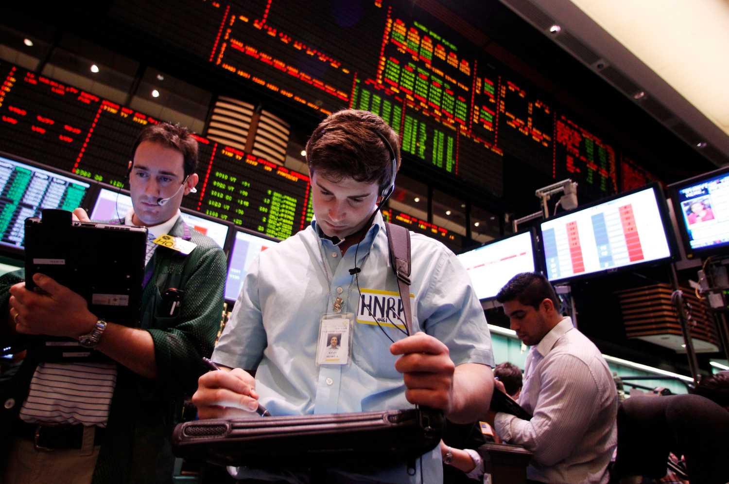 A trader looks at his screen