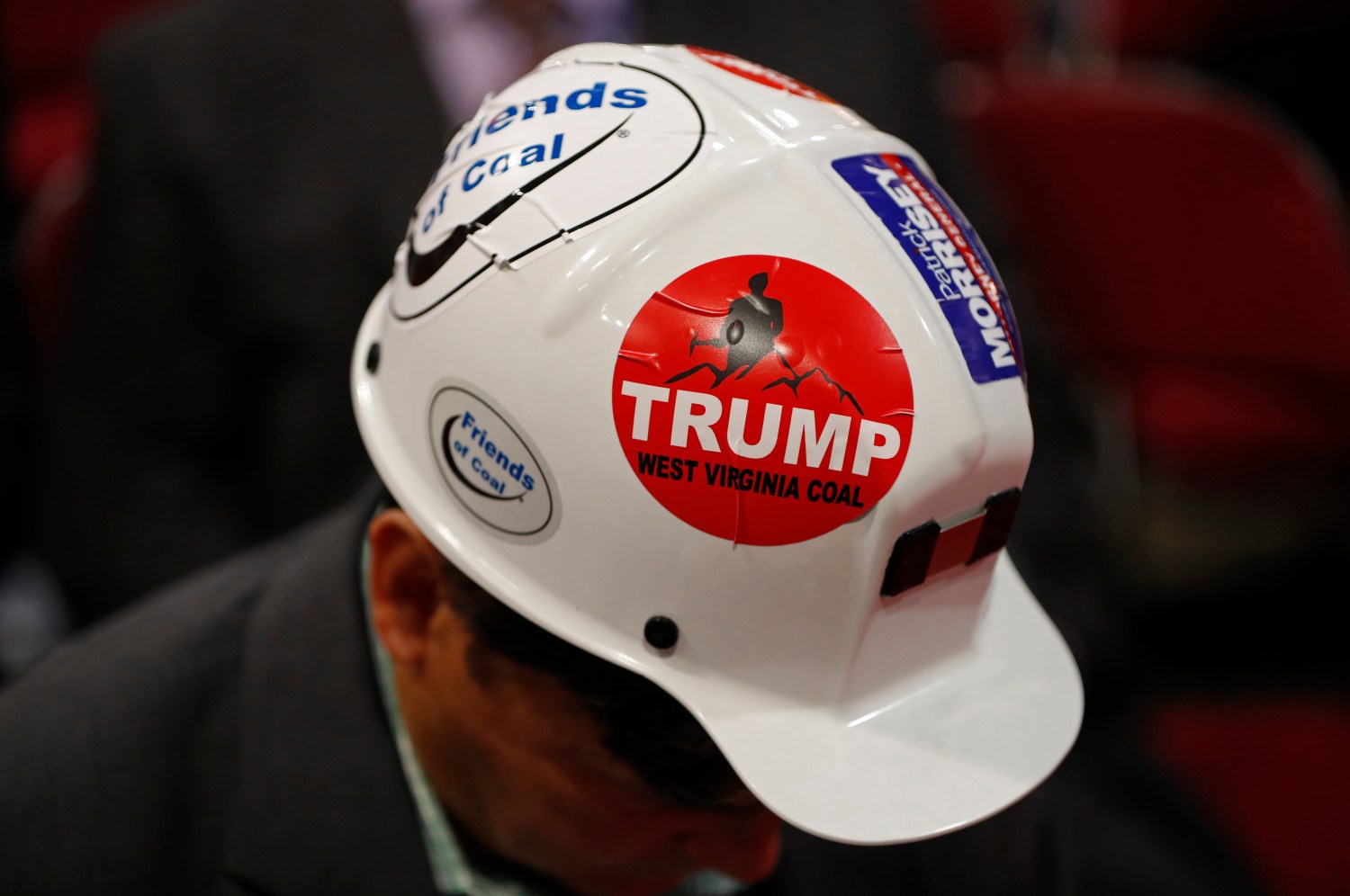 A West Virginia delegate wears a Trump sticker on his hard hat during the second day of the Republican National Convention in Cleveland, Ohio, U.S. July 19, 2016. REUTERS/Aaron P. Bernstein - RTSIREH