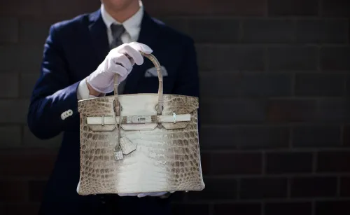 An employee holds an Hermes diamond and Himalayan Nilo Crocodile Birkin handbag at Heritage Auctions offices in Beverly Hills