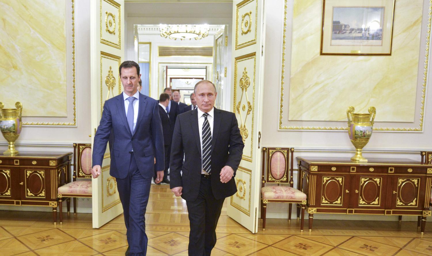 Russian President Vladimir Putin (R) and Syrian President Bashar al-Assad enter a hall during a meeting at the Kremlin in Moscow, Russia, October 20, 2015. Assad made a surprise visit to Moscow on Tuesday evening to thank Putin for launching air strikes against Islamist militants in Syria. Picture taken October 20, 2015. REUTERS/Alexei Druzhinin/RIA Novosti/Kremlin ATTENTION EDITORS - THIS IMAGE HAS BEEN SUPPLIED BY A THIRD PARTY. IT IS DISTRIBUTED, EXACTLY AS RECEIVED BY REUTERS, AS A SERVICE TO CLIENTS. - RTS5E2Z
