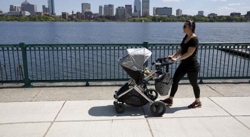 A woman pushes a baby stroller along the Charles River past the Boston skyline in Cambridge, Massachusetts, United States June 10, 2015. Outdoor scenes in Boston show local residents enjoying balmy weather amid lush greenery as the summer solstice approaches on 21 June. The very same locations suffered heavy snowstorms last winter, with snow ploughs, skiers and snowboarders battling the drifts. Boston got 275.8 cm of snow over the winter, the most since 1872, when records began. A few months after the snowstorms, Brian Snyder revisited the same places and shot pictures at exactly the same locations. REUTERS/Brian Snyder TPX IMAGES OF THE DAY PICTURE 16 OF 30 FOR WIDER IMAGE STORY "WINTER FREEZE, SUMMER SOLSTICE" SEARCH "BRIAN SOLSTICE" FOR ALL IMAGES - RTX1H856