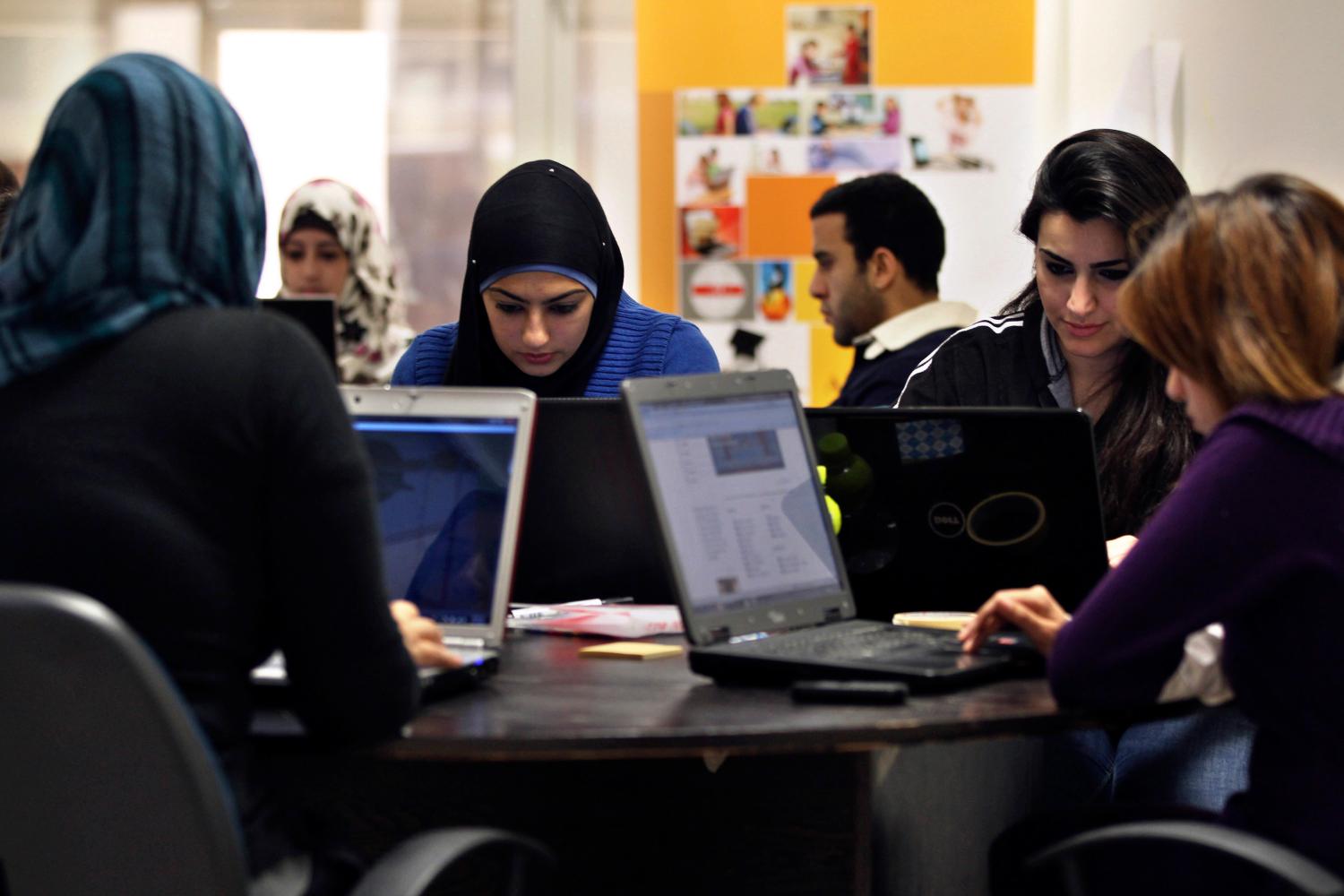 Young entrepreneurs work on their laptops at the Amman-based Oasis 500, a seed investment firm which finances start-up firms in the region's information technology sector, November 2, 2011. Across the Middle East and North Africa, the Arab Spring uprisings have hurt many businessmen. Economies have slowed sharply as political uncertainty deters investment, new governments focus on trying to restore social stability instead of reforming economic policy, and labour unrest disrupts production and drives up costs. Oasis 500's Executive Chairman Usama Fayyad said governments had become more careful about appearing even-handed towards companies, even in countries that have been relatively untouched by the Arab Spring. In the long term, though, a cleaner, fairer business environment could, even more than other economic reforms such as deregulation and fiscal policy changes, help to solve one of the Arab world's biggest problems: job creation. A more level playing field could spur the growth of similar small and medium-sized firms. Picture taken November 2, 2011. To match Mideast Money ARAB-BUSINESS/SPRING REUTERS/Muhammad Hamed