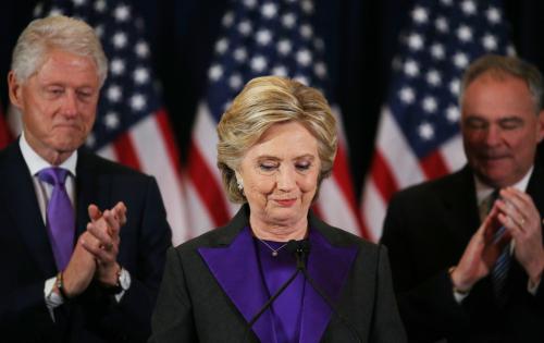 Hillary Clinton, accompanied by her husband former U.S. President Bill Clinton (L) and running mate Senator Tim Kaine, addresses her staff and supporters about the results of the U.S. election at a hotel in New York, November 9, 2016. REUTERS/Carlos Barria - RTX2SVE9