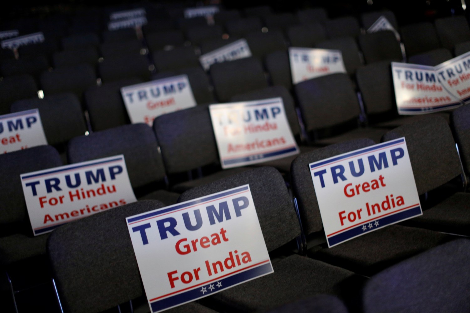 Signs are ready for attendees to hold during Republican presidential nominee Donald Trump's remarks at a Bollywood-themed charity concert put on by the Republican Hindu Coalition in Edison, New Jersey, U.S. October 15, 2016. REUTERS/Jonathan Ernst - RTX2P03T