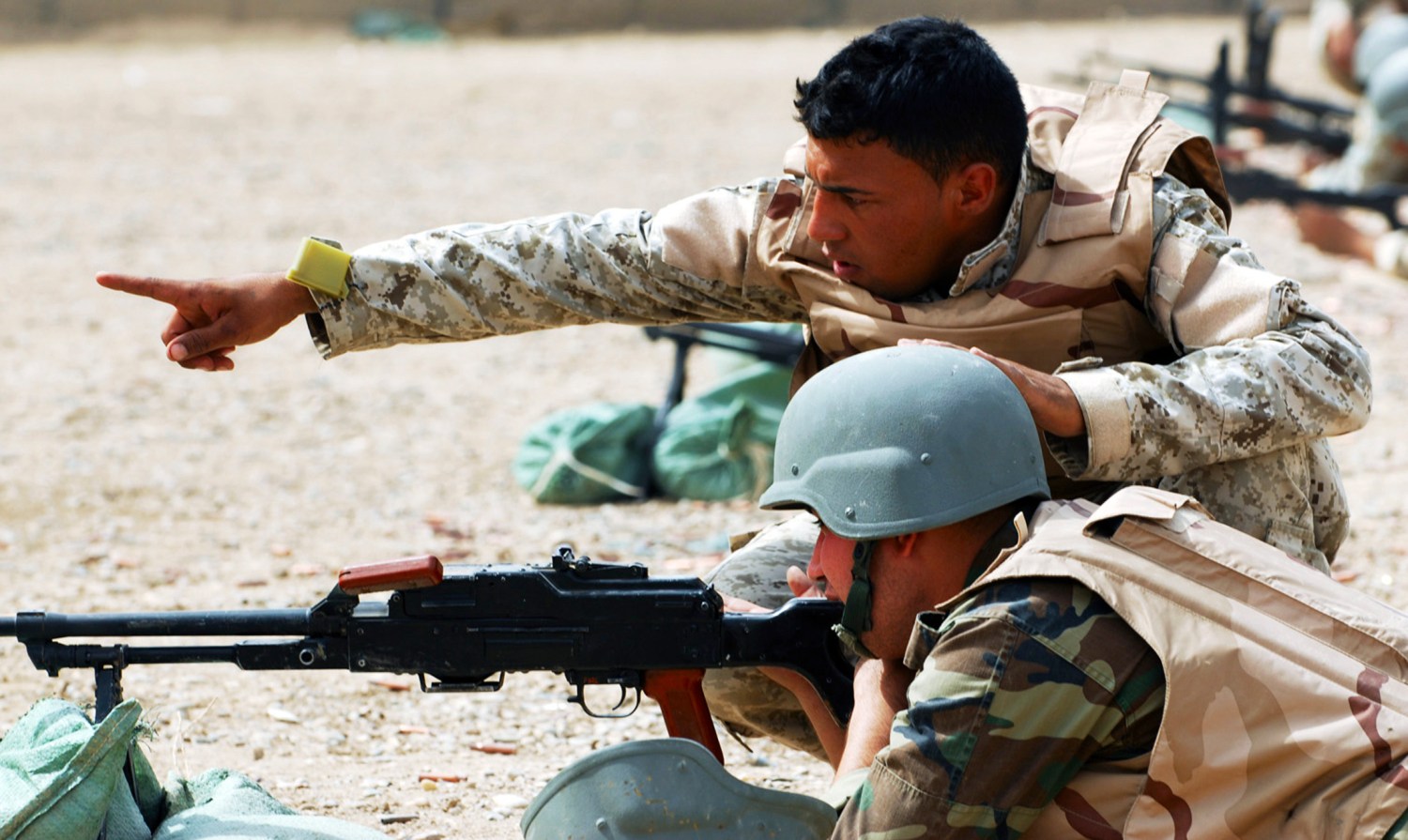 Iraqi army soldiers with the 6th IA Division familiarize themselves with their targets and prepare for a PKC machine gun range at Combat Outpost 402 at al-Muthana airfield in the Rusafa district of Baghdad September 28, 2009. In addition to marksmanship, the IAs also trained on room clearing and movement under fire as part of a larger training program conducted by Soldiers of D Troop, Division Special Troops Battalion, 1st Cavalry Division. Picture taken September 28, 2009. REUTERS/U.S Army/Sgt. Joshua Risner/Handout (IRAQ CONFLICT POLITICS MILITARY) FOR EDITORIAL USE ONLY. NOT FOR SALE FOR MARKETING OR ADVERTISING CAMPAIGNS - RTXP3I3