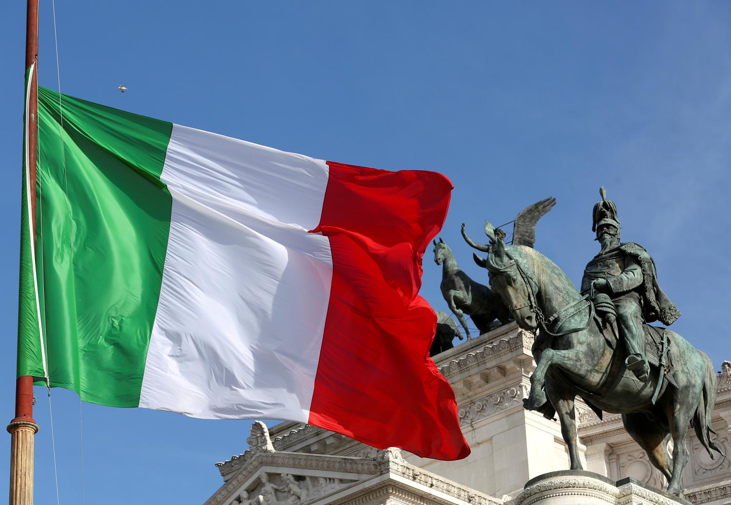 The Italian flag waves in front of The "Altare della Patria" also known as "Vittoriano" downtown Rome, Italy, March 23, 2016. REUTES/ Stefano Rellandini - RTX2CYNT