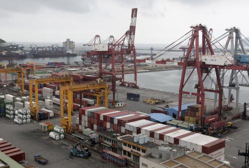 Containers are seen stacked up at Keelung port, northern Taiwan, October 30, 2015