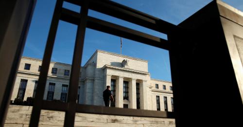 A police officer keeps watch in front of the U.S. Federal Reserve in Washington October 12, 2016. REUTERS/Kevin Lamarque - RTSRYC8