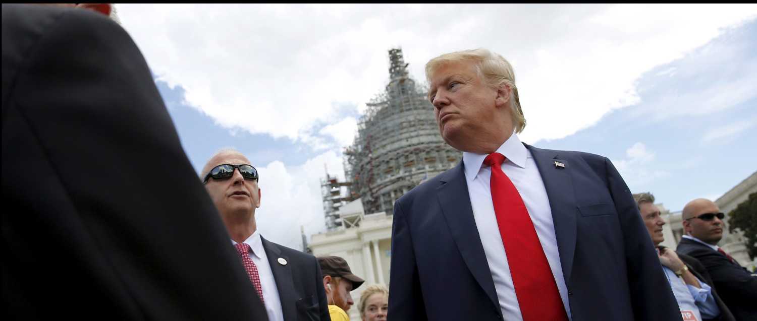 U.S. Republican presidential candidate Donald Trump arrives to address a Tea Party rally against the Iran nuclear deal at the U.S. Capitol in Washington September 9, 2015. REUTERS/Jonathan Ernst - RTSDEW