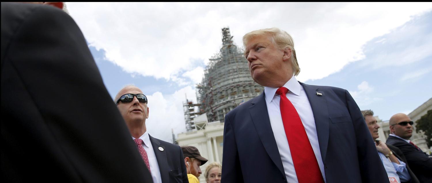 U.S. Republican presidential candidate Donald Trump arrives to address a Tea Party rally against the Iran nuclear deal at the U.S. Capitol in Washington September 9, 2015. REUTERS/Jonathan Ernst - RTSDEW