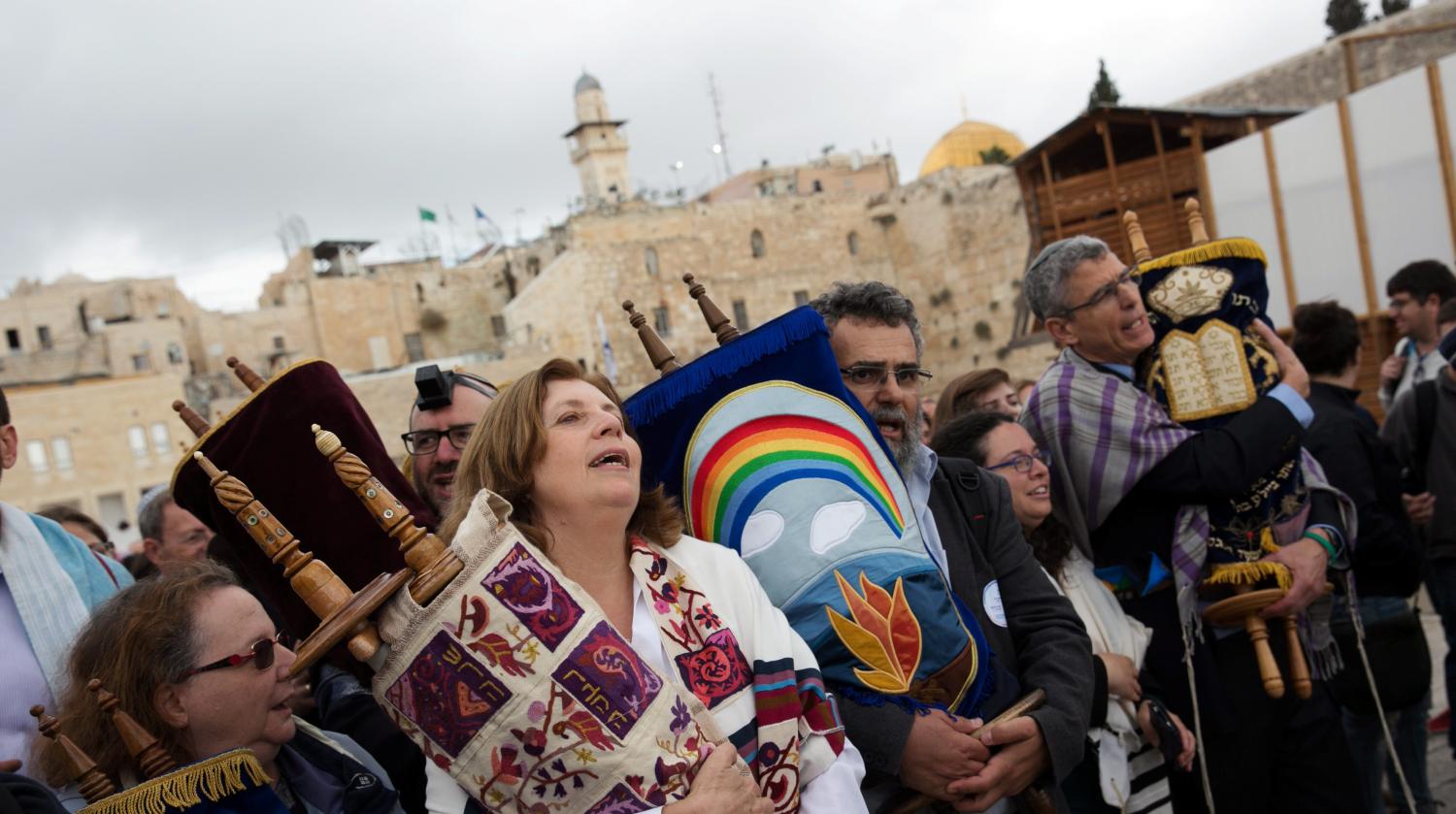 Anat Hoffman (2nd L), chair of "Women of the Wall", an activist group who are challenging the Orthodox monopoly over rites at Western Wall, holds a Torah scroll during a monthly prayer at the Western Wall, Judaism's holiest prayer site, in Jerusalem's Old City November 2, 2016. REUTERS/Michal Fattal ISRAEL OUT. NO COMMERCIAL OR EDITORIAL SALES IN ISRAEL - RTX2RJD5