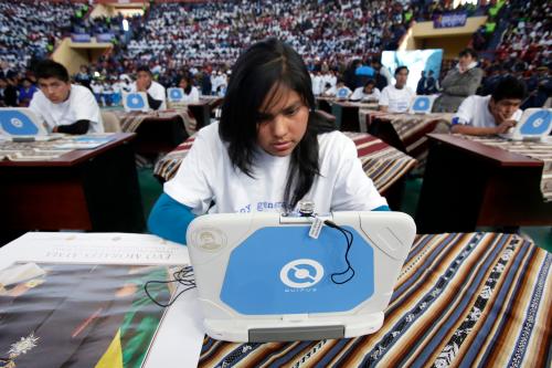 A high school student tests a "Quipus" laptop during a presentation ceremony in El Alto, July 31, 2014. Some 15,000 public school students received the laptops, assembled by Bolivian state-run company Quipus, during the ceremony. According to local media, El Alto schools will receive a total of some 140,000 laptops this year as part of a government initiative to provide final-year high school students with access to a new laptop, aiming to incorporate the use of new technology in educational institutions. REUTERS/David Mercado (BOLIVIA - Tags: EDUCATION POLITICS SOCIETY) - RTR40UBC