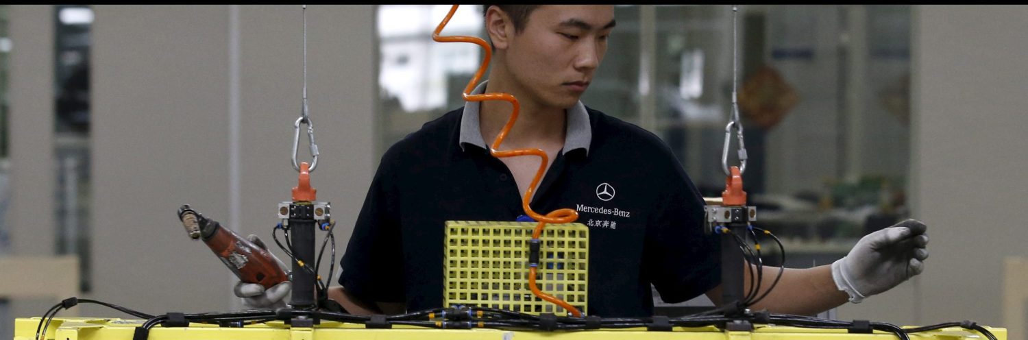 An employee works on an assembly line producing Mercedes-Benz cars at a factory of Beijing Benz Automotive Co. (BBAC) in Beijing, China, August 31, 2015. BBAC is the joint venture company which Daimler runs with Chinese partner Beijing Automotive Group Co. REUTERS/Kim Kyung-Hoon - RTX1QDC2
