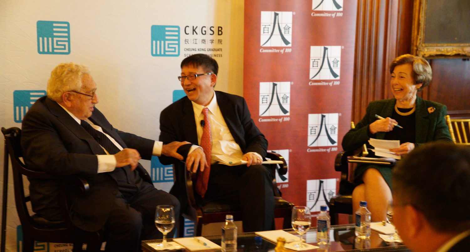 Henry Kissinger, Cheng Li, and Carla Hills speak at an event.