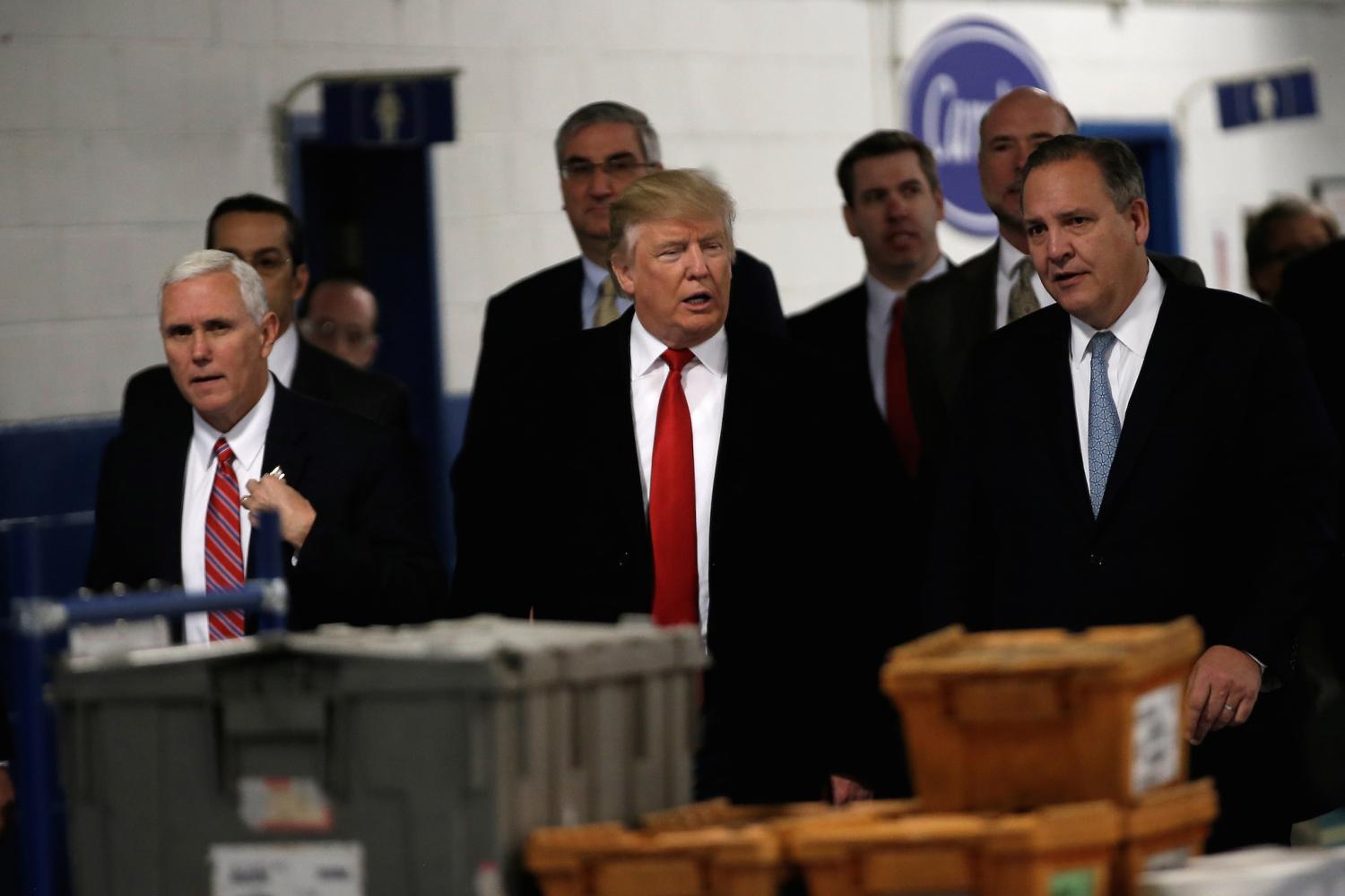 U.S. President-elect Donald Trump tours a Carrier factory with Greg Hayes, CEO of United Technologies (R) and Vice President-elect Mike Pence