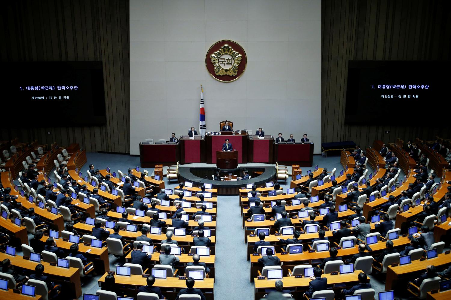 Lawmakers attend a plenary session to vote on the impeachment bill of President Park Geun-hye at the National Assembly in Seoul, South Korea, December 9, 2016. REUTERS/Kim Hong-Ji - RTSVCEL