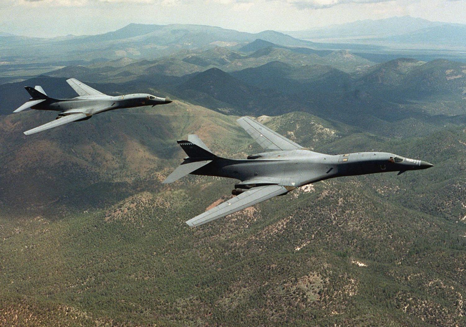 A pair of B-1B Lancer bombers soar over Wyoming in an undated file photo. Staff Sgt. Steve Thurow/U.S. Air Force/Handout via REUTERS ATTENTION EDITORS - THIS IMAGE WAS PROVIDED BY A THIRD PARTY. EDITORIAL USE ONLY. - RTSNAQ6