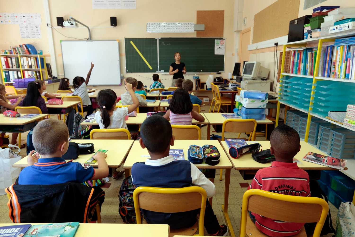 Elementary school children are seen in a classroom on the first day of class in the new school year in Nice, September 3, 2013.