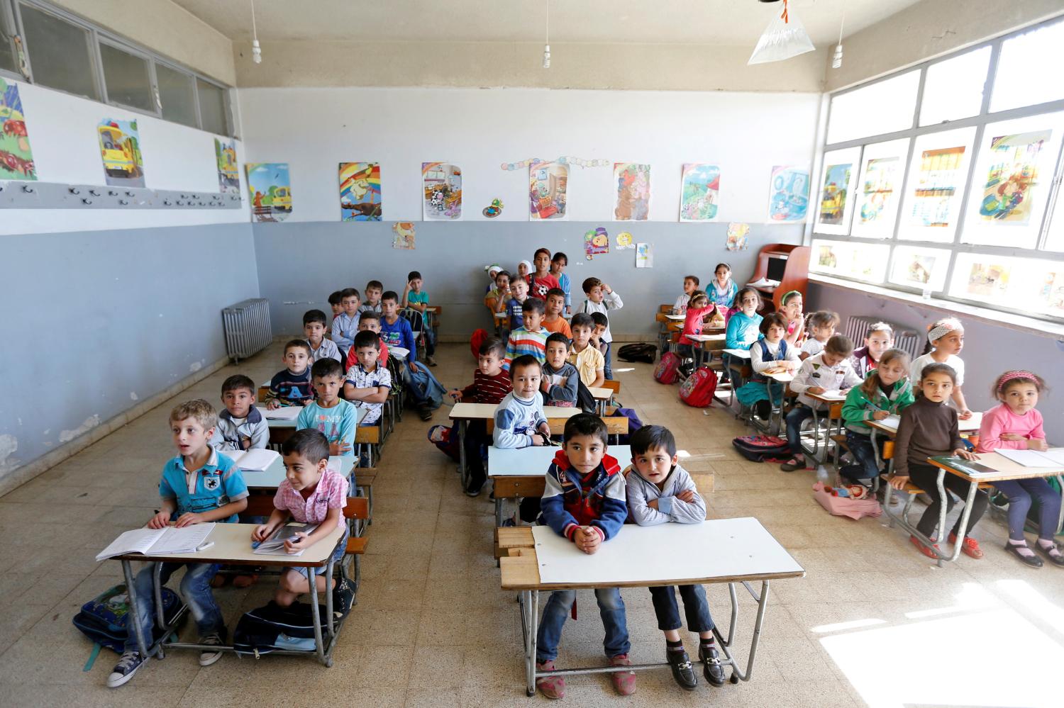 Syrian refugee children attend a class at a school in Mount Lebanon, October 7, 2016. REUTERS/Mohamed Azakir - RTSR7GP