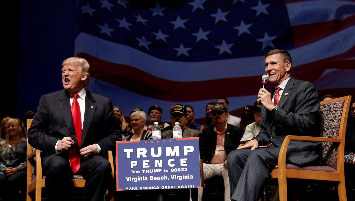 Republican presidential nominee Donald Trump (L) speaks along side retired U.S. Army Lieutenant General Mike Flynn during a campaign town hall meeting in Virginia Beach, Virginia, U.S., September 6, 2016. REUTERS/Mike Segar - RTX2OE6J