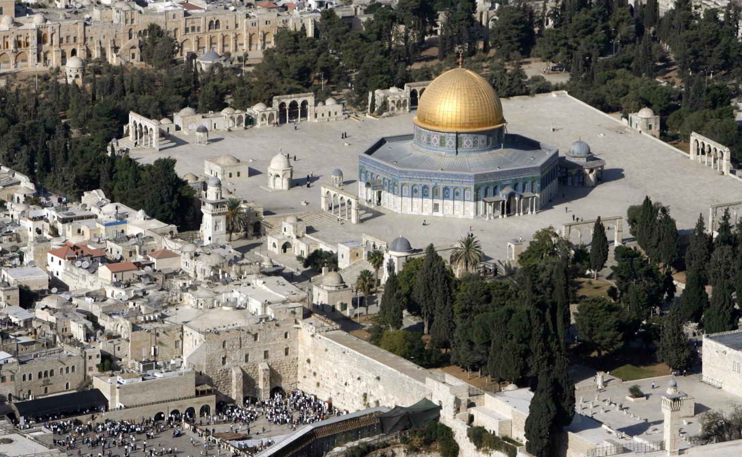 An aerial view shows the Dome of the Rock (R) on the compound known to Muslims as the Noble Sanctuary and to Jews as Temple Mount, and the Western Wall (L) in Jerusalem's Old City.