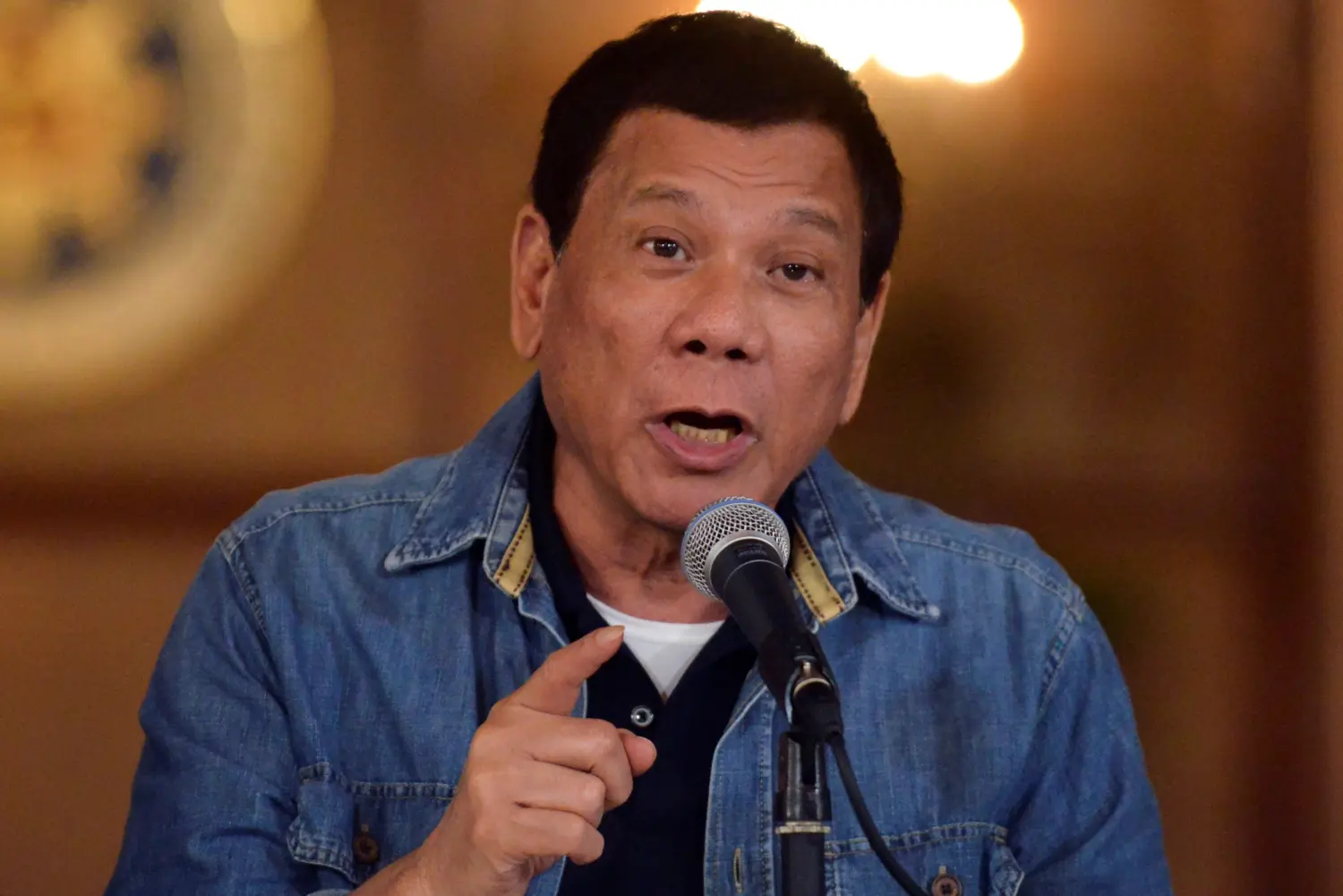 Philippine President Rodrigo Duterte gestures while speaking during a late night news conference at the presidential palace in Manila, Philippines January 30, 2017. REUTERS/Ezra Acayan