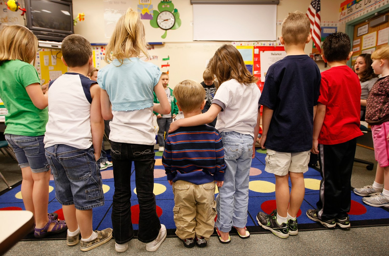 First grader Adam Kotzian (C) does a spelling drill with classmates in his classroom at Eagleview Elementary school in Thornton, Colorado..