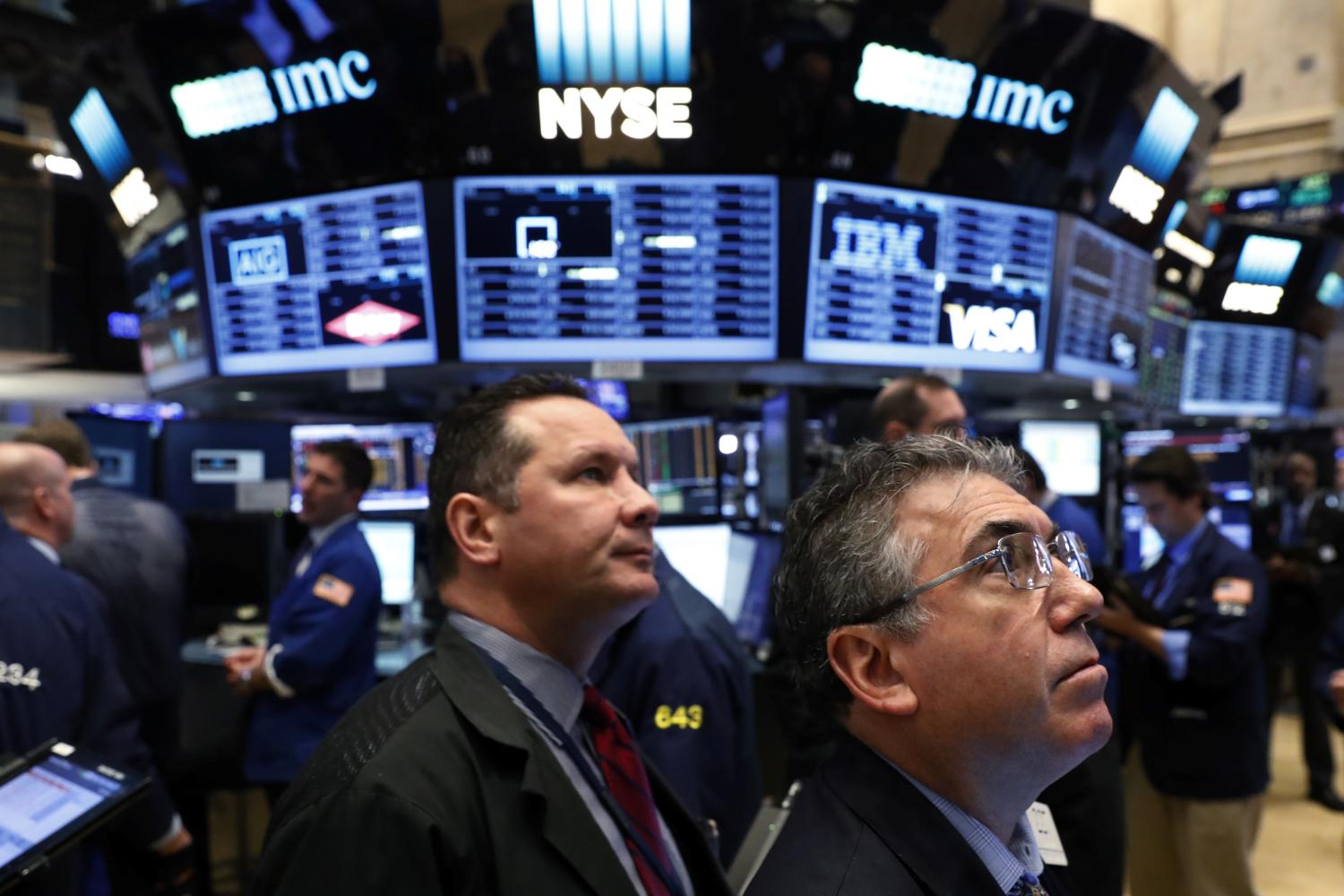 Traders work on the floor of the New York Stock Exchange (NYSE) shortly after the opening bell in New York City, NY.