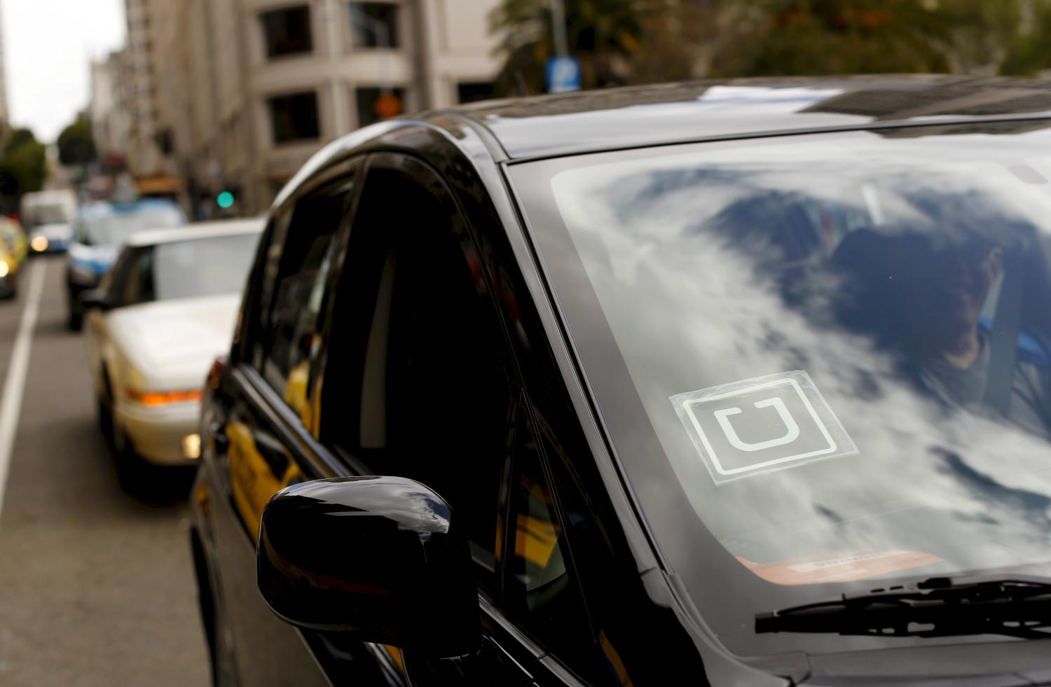 The Uber logo is seen on a vehicle near Union Square in San Francisco.