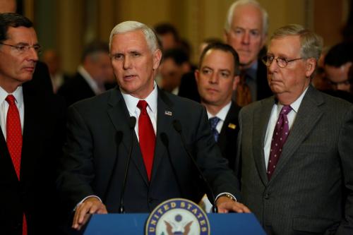 U.S. Vice President-elect Mike Pence (C) and Republican National Committee Chairman Reince Priebus (2nd R) join Senate Majority Leader Mitch McConnell (R) to speak with reporters after the weekly Republican caucus luncheon at the U.S. Capitol on Washington, U.S. January 4, 2017. Also pictured are U.S. Senator John Barrasso (R-WY) and Senator John Cornyn (R-TX). REUTERS/Jonathan Ernst - RTX2XJZ2
