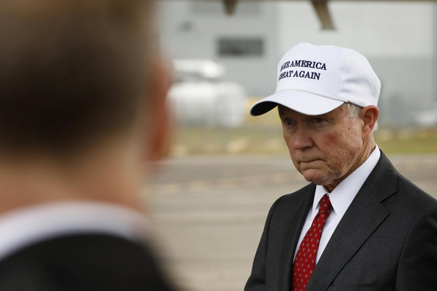 Senator Jeff Sessions (R-AL) waits for U.S. President-elect Donald Trump to exit his plane after arriving for stop on his USA Thank You Tour event in Mobile, Alabama, U.S., December 17, 2016. REUTERS/Lucas Jackson - RTX2VHFQ