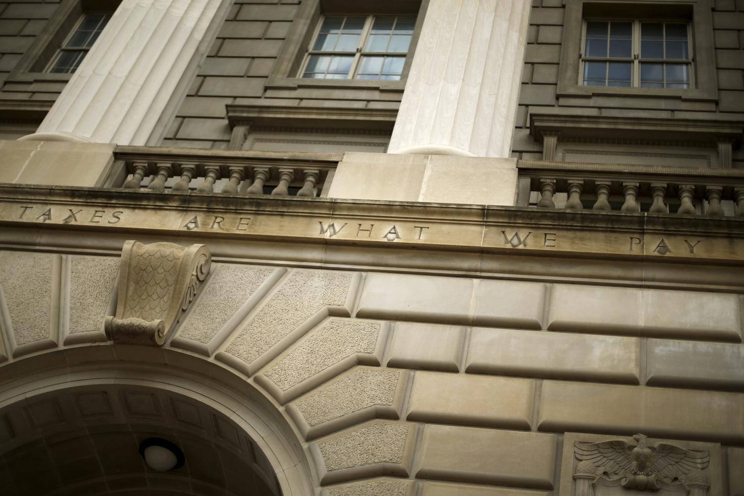 A general view of the U.S. Internal Revenue Service (IRS) building, with the partial quote "taxes are what we pay," in Washington May 27, 2015. Tax return information for about 100,000 U.S. taxpayers was illegally accessed by cyber criminals over the past four months, U.S. IRS Commissioner John Koskinen said on Tuesday, the latest in a series of data thefts that have alarmed American consumers. The entire quote chiseled on the building, from Oliver Wendell Holmes, reads, "Taxes are what we pay for a civilized society''. REUTERS/Jonathan Ernst - RTX1EU9N