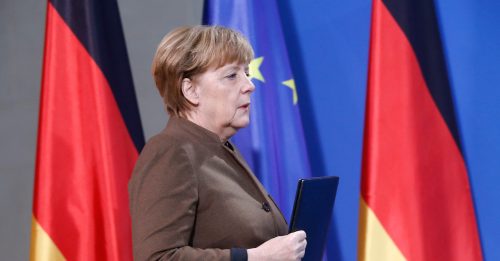 German Chancellor Angela Merkel walks before delivering a statement in Berlin, Germany, December 23, 2016. REUTERS/Hannibal Hanschke - RTX2WALU