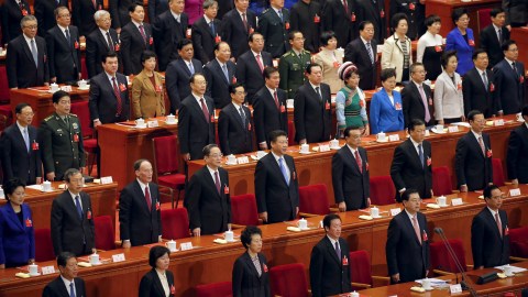 President Xi Jinping (2nd row, 5th L), Premier Li Keqiang (2nd row, 6th L) and other Chinese leaders sing China's national anthem during the closing ceremony of National People's Congress (NPC) at the Great Hall of the People in Beijing, China, March 16, 2016. REUTERS/Damir Sagolj - RTSAMOJ