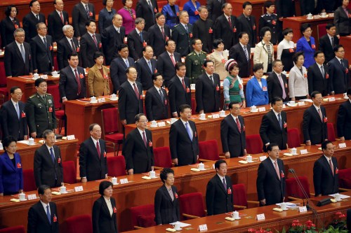President Xi Jinping (2nd row, 5th L), Premier Li Keqiang (2nd row, 6th L) and other Chinese leaders sing China's national anthem during the closing ceremony of National People's Congress (NPC) at the Great Hall of the People in Beijing, China, March 16, 2016. REUTERS/Damir Sagolj - RTSAMOJ