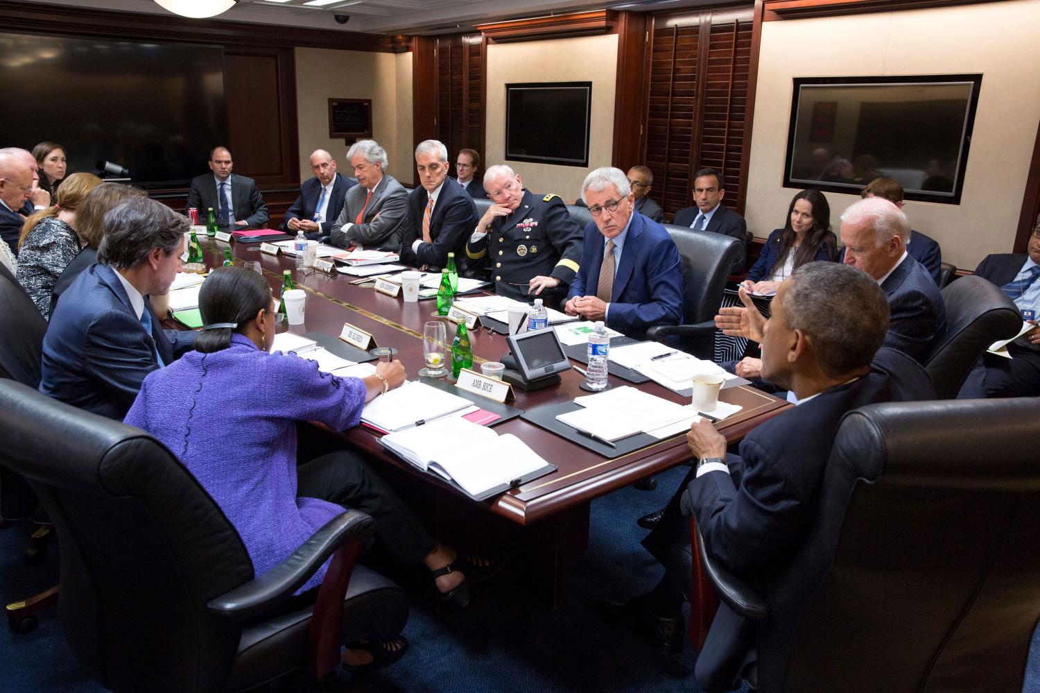 President Barack Obama (2nd R) and Vice President Joe Biden (R) meet with members of the National Security Council in the Situation Room of the White House in Washington September 10, 2014. Obama, who will set out a broad long-term strategy to defeat the Islamic State in a speech to Americans on Wednesday evening, is prepared to authorize air strikes against the group in Syria, U.S. officials said. REUTERS/The White House/Pete Souza/Handout via Reuters (UNITED STATES - Tags: POLITICS) THIS IMAGE HAS BEEN SUPPLIED BY A THIRD PARTY. IT IS DISTRIBUTED, EXACTLY AS RECEIVED BY REUTERS, AS A SERVICE TO CLIENTS. FOR EDITORIAL USE ONLY. NOT FOR SALE FOR MARKETING OR ADVERTISING CAMPAIGNS - RTR45QKO