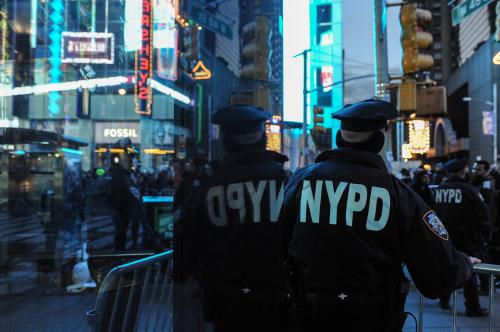 A member of the police force stands guard in Times Square on New Year's Eve in New York, U.S. December 31, 2016. REUTERS/Stephanie Keith - RTX2X3F9