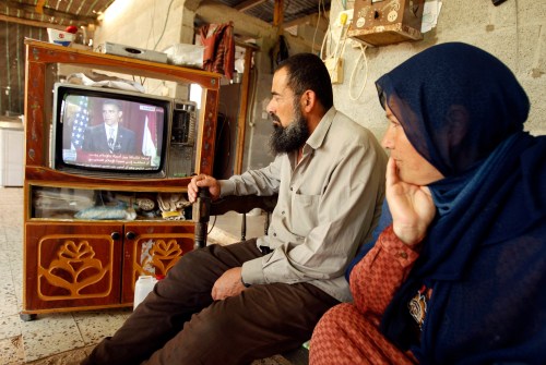 Palestinians watch a television broadcasting the speech of U.S. President Barack Obama in Cairo, at their house in Khan Younis in the southern Gaza Strip June 4, 2009. Obama sought a "new beginning" between the United States and Muslims around the world in a major speech on Thursday but offered no new initiative to end the Palestinian-Israeli conflict. REUTERS/Ibraheem Abu Mustafa (GAZA POLITICS RELIGION) - RTR249LP