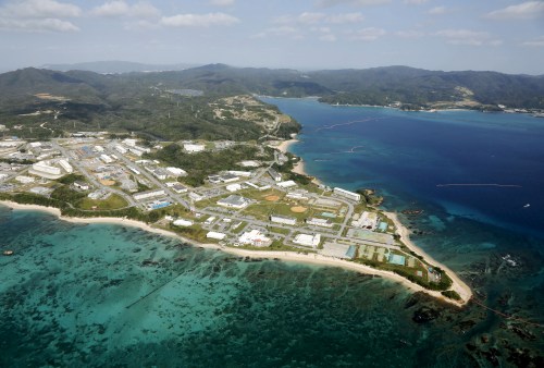 Coral reefs are seen along the coast near the U.S. Marine base Camp Schwab, off the tiny hamlet of Henoko in Nago, on the southern Japanese island of Okinawa, in this file aerial photo taken by Kyodo October 29, 2015 file photo. Mandatory credit REUTERS/Kyodo/Files ATTENTION EDITORS - THIS IMAGE HAS BEEN SUPPLIED BY A THIRD PARTY. FOR EDITORIAL USE ONLY. NOT FOR SALE FOR MARKETING OR ADVERTISING CAMPAIGNS. MANDATORY CREDIT. JAPAN OUT. NO COMMERCIAL OR EDITORIAL SALES IN JAPAN. - RTSG5L0