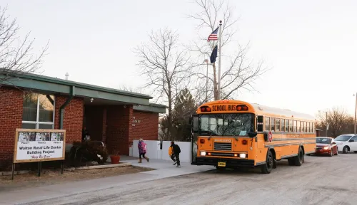 Students arrive at the Walton Rural Life Center Elementary School, in Walton, Kansas, January 18, 2013. Students at the school do farm chores at the beginning of each school day. The Walton Rural Life Center - a kindergarten through fourth grade charter school in rural Kansas - uses agriculture to teach students about math, science, economics. REUTERS/Jeff Tuttle (UNITED STATES - Tags: EDUCATION AGRICULTURE SOCIETY) - RTR3DVPU