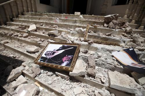 DATE IMPORTED:April 21, 2015A picture of Saudia Arabia's King Salman bin Abdulaziz lies amidst debris at the damaged entrance to the headquarters of the Saudi Cultural Center in Sanaa, caused by an April 20 air strike that hit a nearby army weapons depot, in Sanaa April 21, 2015. REUTERS/Mohamed al-Sayaghi
