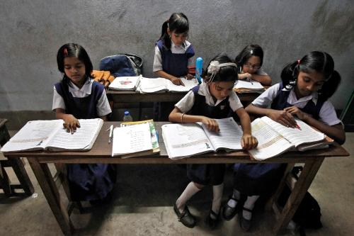 Schoolchildren study inside their classroom at a government-run school in Kolkata